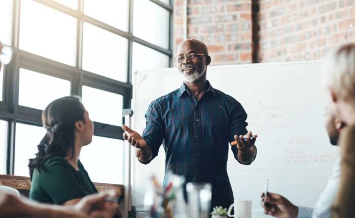 Presentation,,Man,And,Meeting,On,Whiteboard,In,Office,For,Feedback,
