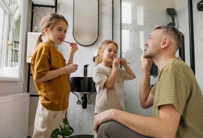 A,Father,Teaches,His,Two,Daughters,How,To,Brush,Their
