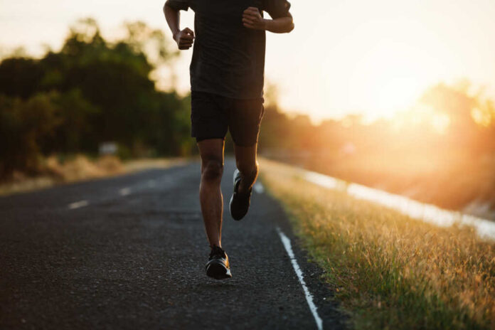 Athlete,Runner,Feet,Running,On,Road