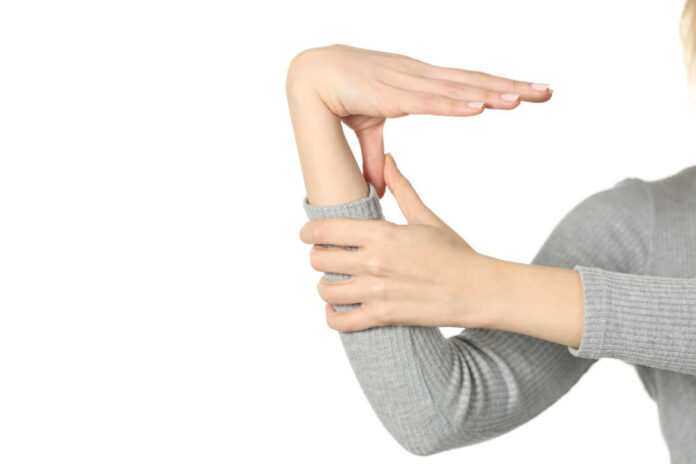 Close,Up,Of,Hypermobile,Woman,Hand,Bending,Thumb,And,Wrist