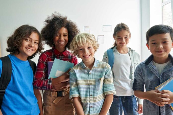 Happy,Diverse,Junior,School,Students,Children,Group,Looking,At,Camera