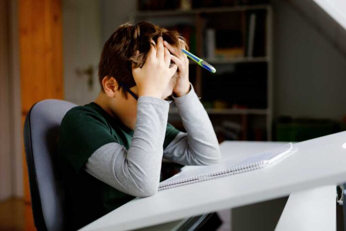 Hard-working,Sad,School,Kid,Boy,Making,Homework,During,Quarantine,Time