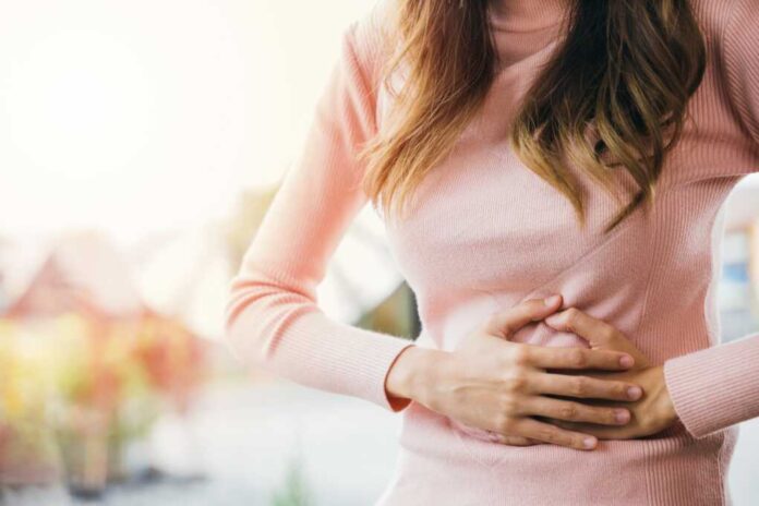 Asian,Young,Female,Suffers,From,Stomachache,After,Eating,Spoiled,Food,