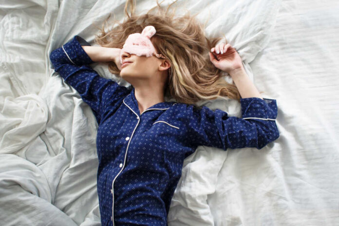 Cute,Blonde,In,Her,Bed,In,Blue,Pajamas,And,Sleep