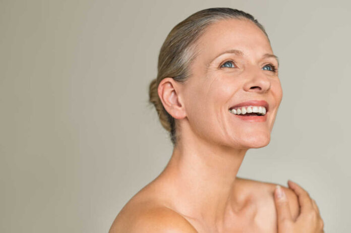 Portrait,Of,A,Cheerful,Senior,Woman,Smiling,While,Looking,Away