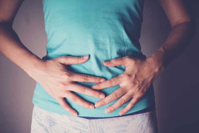 Woman,Hands,On,Her,Stomach,,Probiotics,And,Prebiotics,Food,For