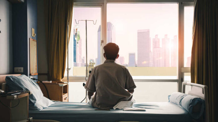 Patient,Sat,On,The,Bed,And,Looked,Out,The,Window