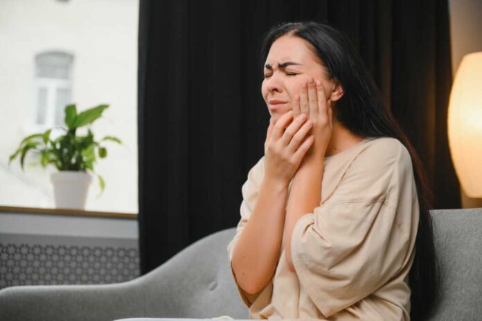 Woman,With,Severe,Toothache,Touching,Her,Swollen,Cheek.,Young,Girl