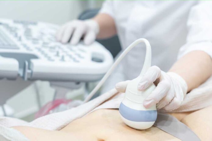 Gynecologist,Doing,Ultrasound,Scan,In,Modern,Clinic