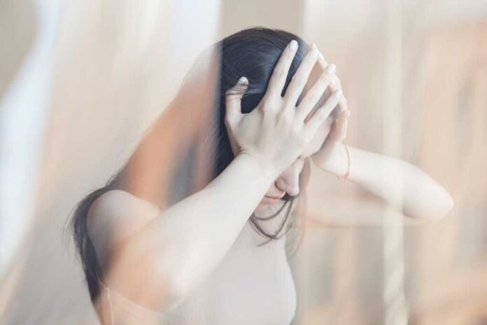 Distorted,Portrait,Of,Young,Woman,Struggling,With,Headache,And,Mental