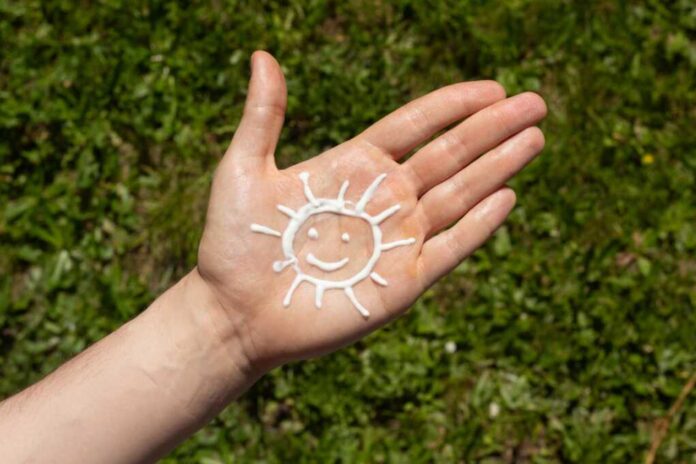A,Person,Applying,The,Correct,Amount,Of,Sunscreen,For,Face