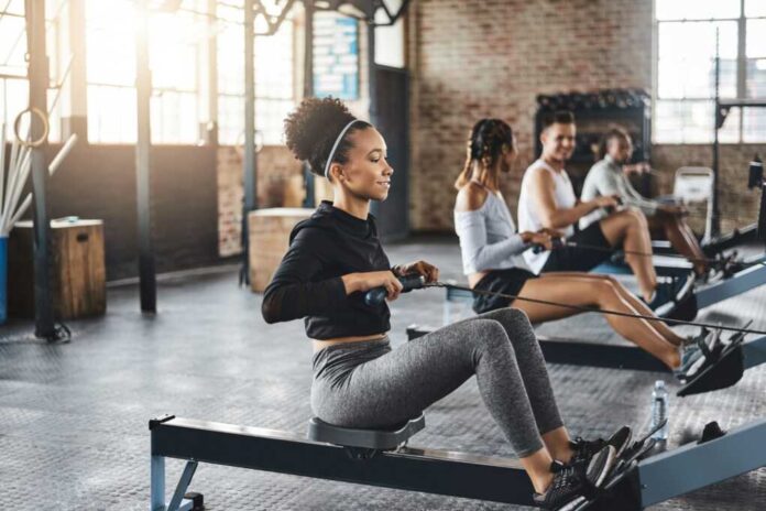 Endurance,,Gym,And,Woman,On,Rowing,Machine,For,Health,,Wellness