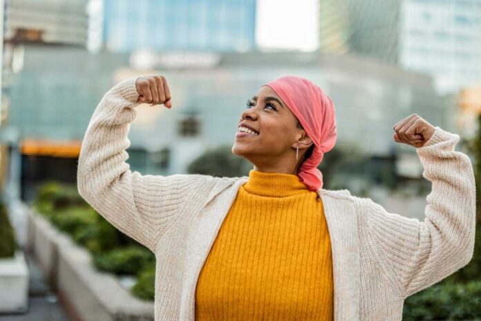 Joyful,Cancer,Survivor,In,Her,30s,,Wearing,A,Pink,Headscarf