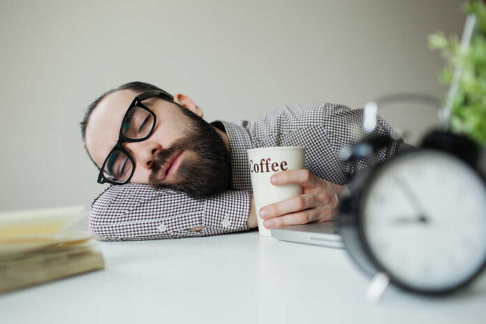 Man,With,Beard,In,Glasses,Sleeps,In,Office,On,The