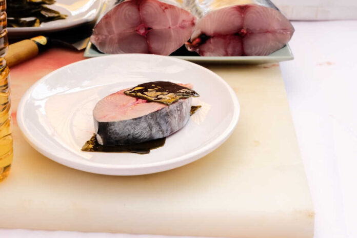 Raw,Fresh,Fish,Fillet,On,Chopping,Board,.
