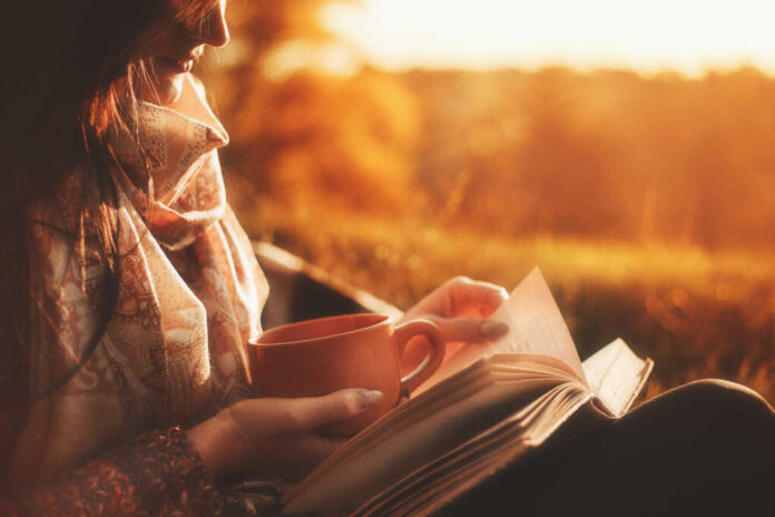 Beautiful,Girl,In,Autumn,Forest,Reading,A,Book,Covered,With