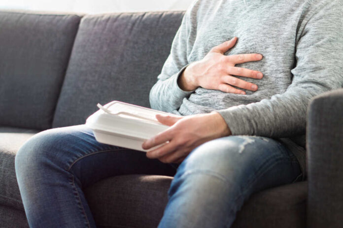 Stomach,Pain,,Food,Poisoning,Or,Digestion,Problem,After,Fast,Junk