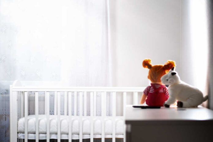Children's,White,Room,With,An,Empty,Cradle,And,Toys,On