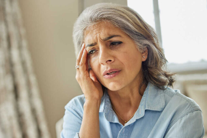 Mature,Woman,At,Home,Suffering,From,Headache,Or,Memory,Loss