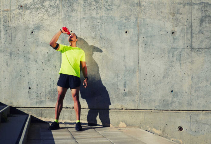 Young,Muscular,Build,Man,With,Running,Armband,On,The,Arm