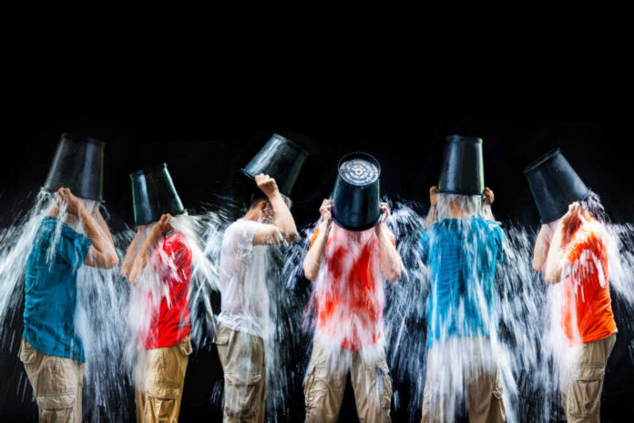 Man,Pour,A,Bucket,Of,Ice,Topped,Their,Head,On