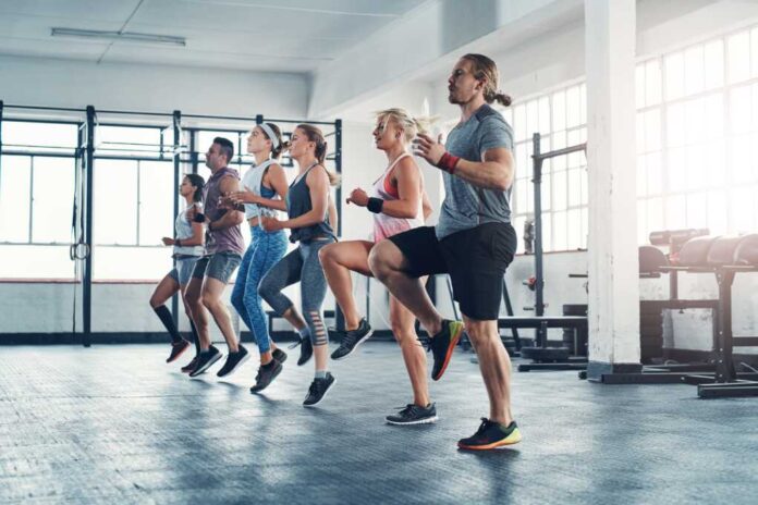 Fitness,,People,And,Exercise,With,Warm,Up,For,Leg,Training,