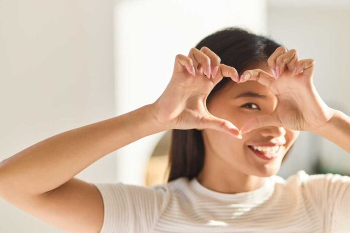 Eye,Care.,Woman,Framing,Eye,With,Heart-shaped,Hands,,Symbolizing,Love