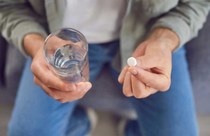 Sick,Man,Taking,His,Daily,Dose,Of,Medicine,At,Home.