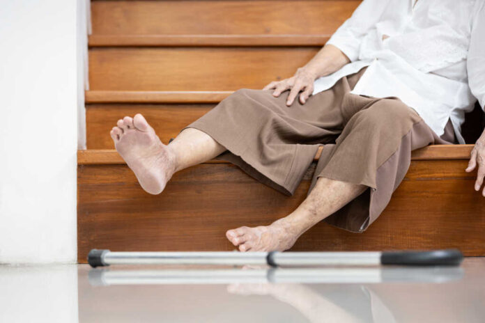 Old,Elderly,Lies,Unconscious,On,The,Floor,Of,The,Staircase