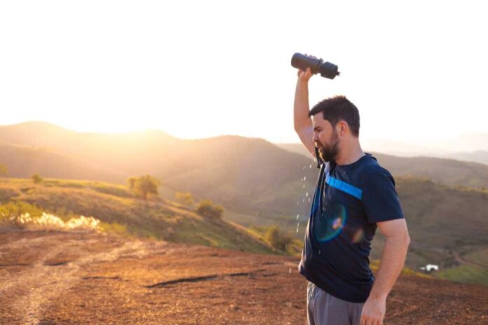 Man,Refreshes,In,Scorching,Heat,,Pouring,Water,On,Himself,Outdoors,