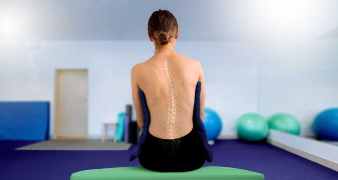 Young,Woman,From,The,Back,In,A,Physiotherapy,Clinic,,Illustrating