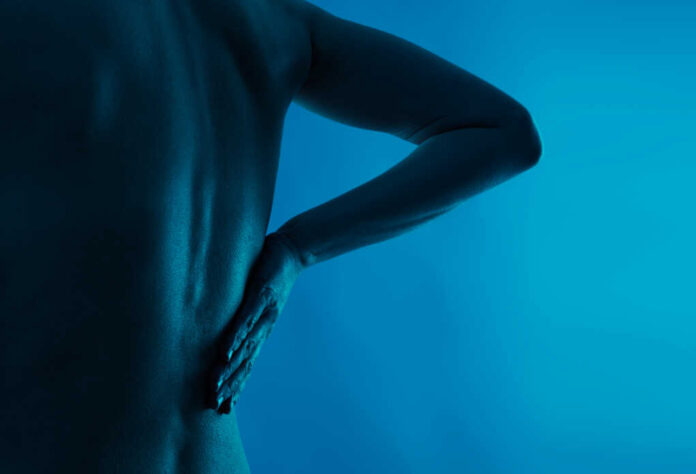 Back,And,Loin,Pain.,Young,Person,Suffering,From,Osteoporosis.,Health