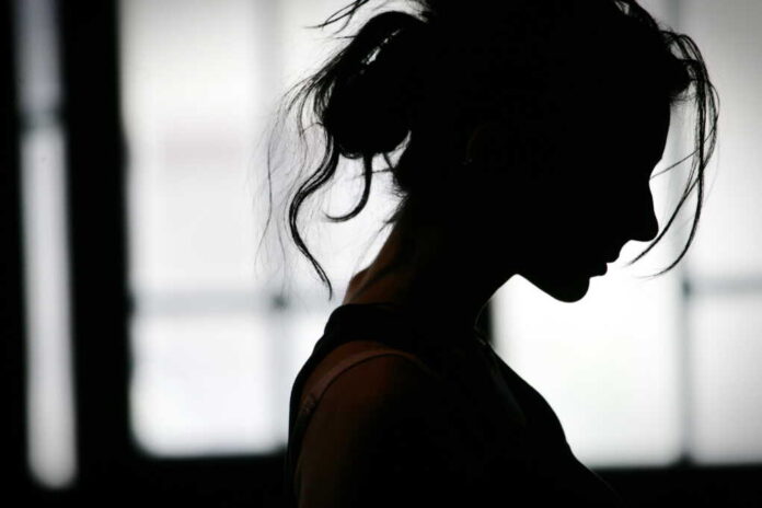 Silhouette,Of,Woman's,Head,With,Waving,Hair,,Back,Light.