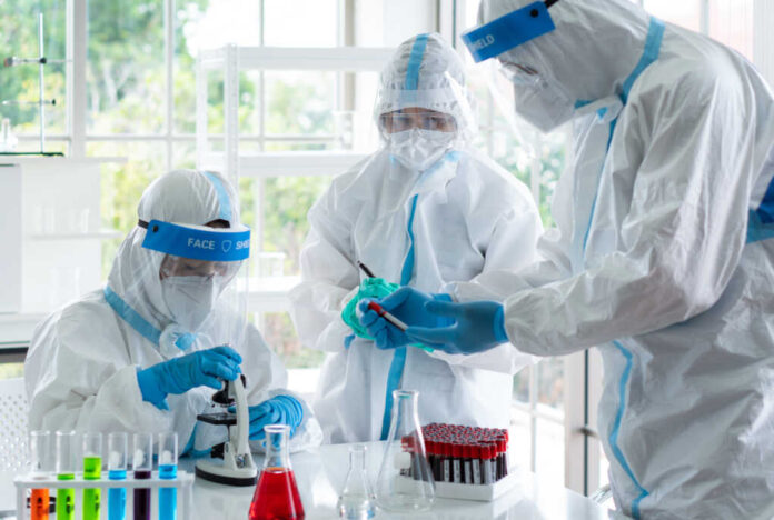 Scientists,In,Personal,Protective,Equipment,Or,Ppe,Doing,Research,And