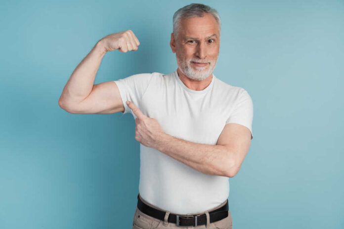 Senior,Bearded,Man,Showing,Muscles,Wearing,White,T-shirt,Pose,On