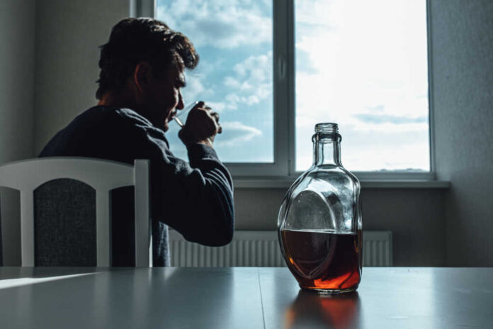 Depressed,Alcohol,Addict,Sitting,Near,Window.,Side,View,Of,Sad