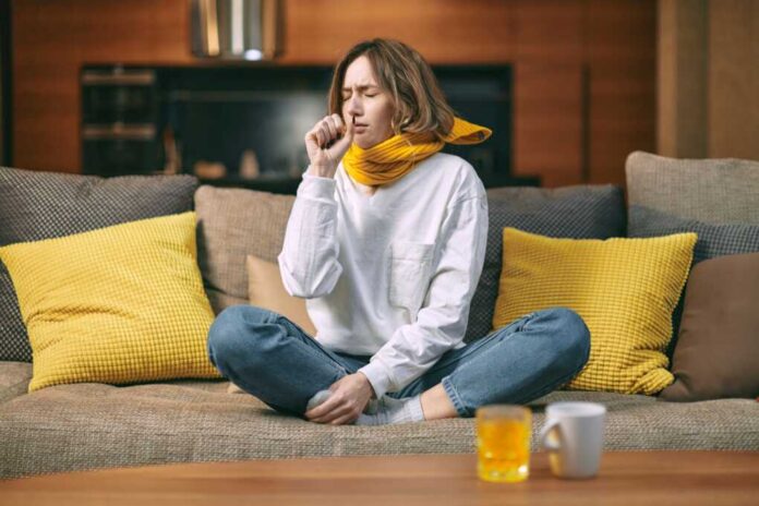 Cold,,flu,Cough.,Sick,Woman,Coughing,Sitting,On,Sofa,At