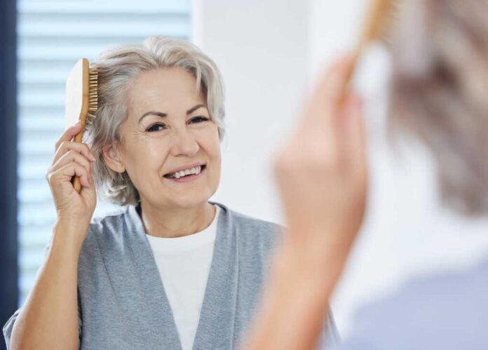 Home,,Senior,Woman,And,Comb,Hair,In,Mirror,For,Maintenance,