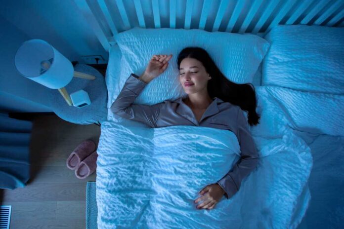 Top,View,Of,Young,Calm,Woman,Sleeping,Cozily,On,Bed