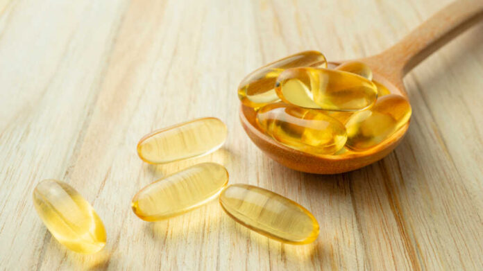 Fish,Oil,Capsules,With,Omega3,And,Vitamin,D,In,Wooden