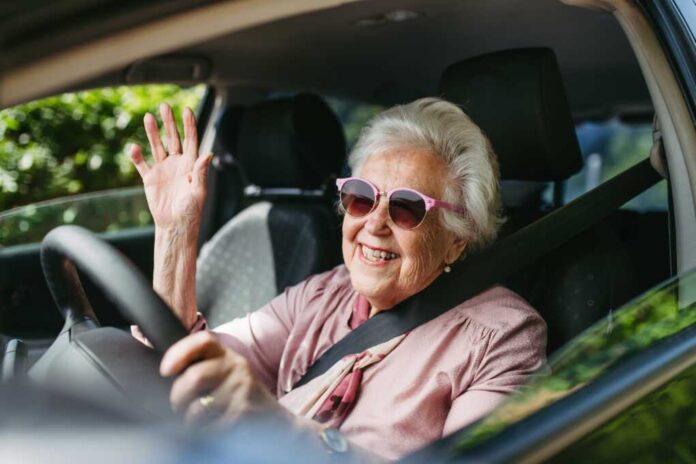 Happy,Senior,Woman,Driving,Car,Alone,,Enjoying,Car,Ride.,Safe