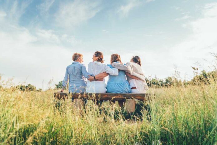 Four,Smiling,Women,Dressed,Light,Summer,Clothes,Harm,Embracing,Sitting