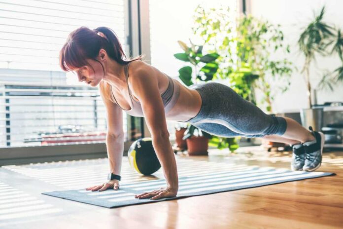 Beautiful,Redhead,Woman's,Home,Fitness,Routine.,Home,Workout,On,Gym