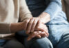 DIY Couples Therapy: Seven Steps to Stronger Bonds Close-up of two hands gently holding each other, symbolizing support and affection