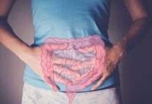Is Your Gut Hiding a Cancer Trigger? Person holding their stomach with a graphic of intestines overlayed