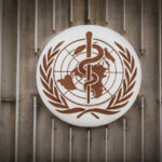 WHO Certifies Algeria’s Astonishing Health Victory World Health Organization emblem featuring a globe and caduceus