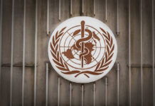 World Health Organization emblem featuring a globe and caduceus