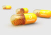 Vitamin D capsules with orange beads inside