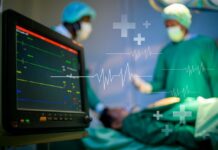 Medical professionals in an operating room monitoring a patient
