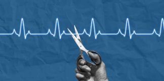 A hand holding scissors above a heartbeat line on a blue background